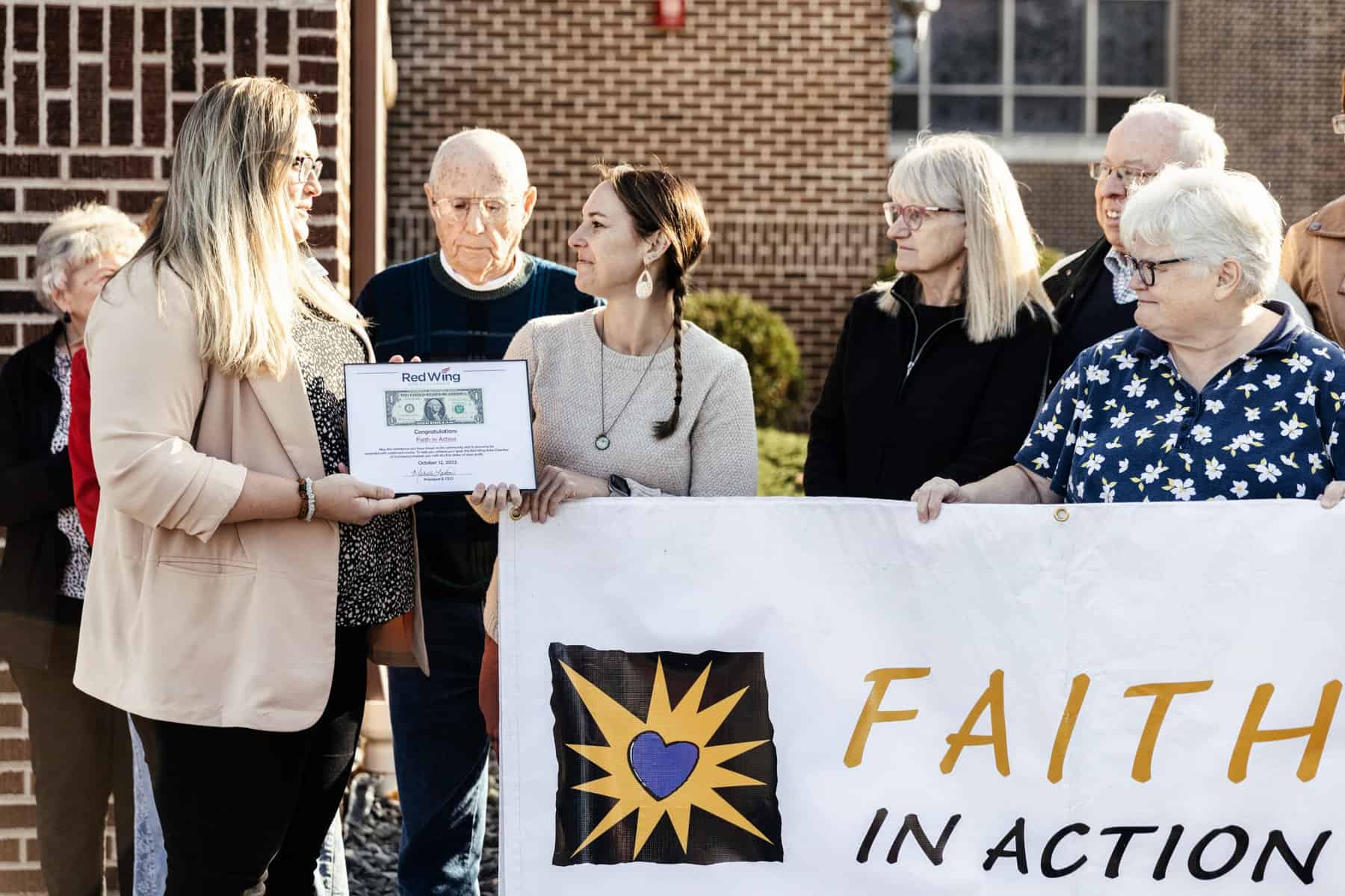 Faith in Action receiving a donation